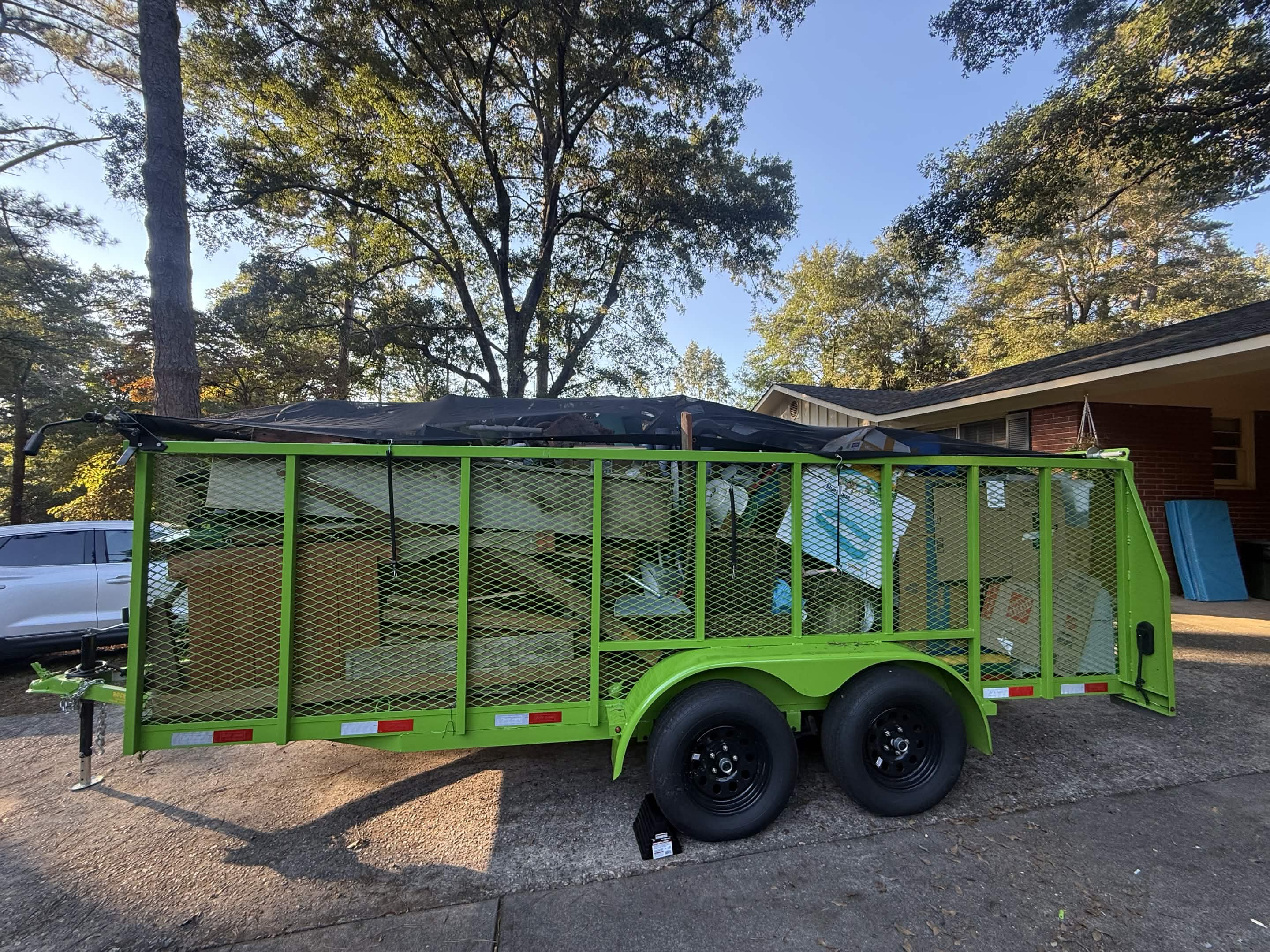 D&S Junk Removal 16 ft rentable dumpster trailer with the D&S banner